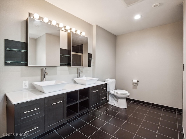 623 N Main St, Stuart, IA 50250 - full bathroom featuring double vanity, a shower, and tile patterned flooring