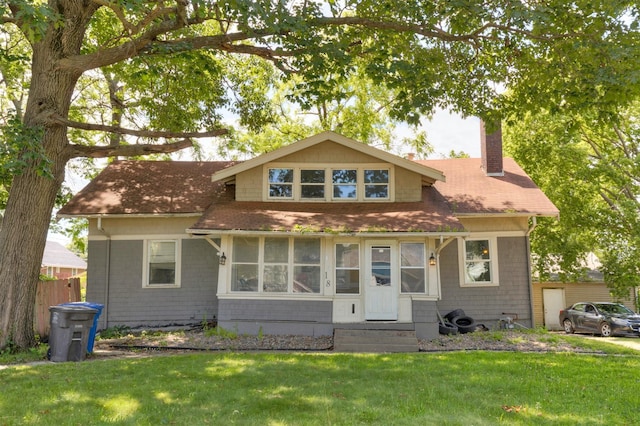 1118 Euclid Ave, Des Moines, IA 50313 - bungalow-style house with a chimney, roof with shingles, and entry steps