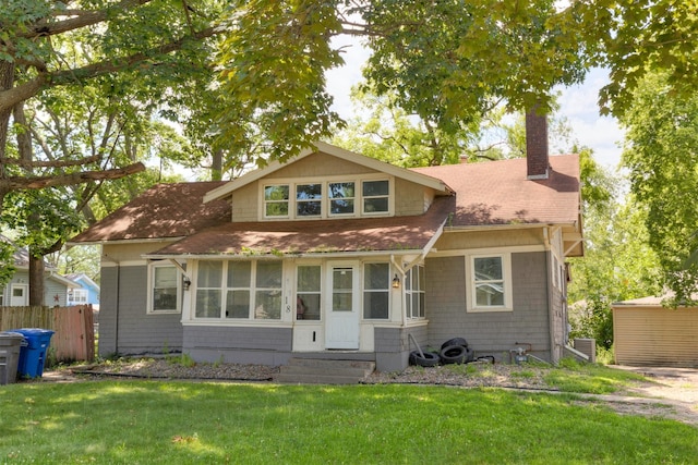 1118 Euclid Ave, Des Moines, IA 50313 - bungalow-style house featuring roof with shingles, entry steps, and a chimney