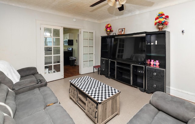 1118 Euclid Ave, Des Moines, IA 50313 - living room featuring ceiling fan, a textured ceiling, and french doors