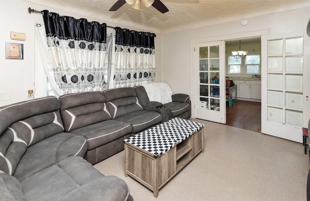1118 Euclid Ave, Des Moines, IA 50313 - living room featuring ceiling fan and a textured ceiling