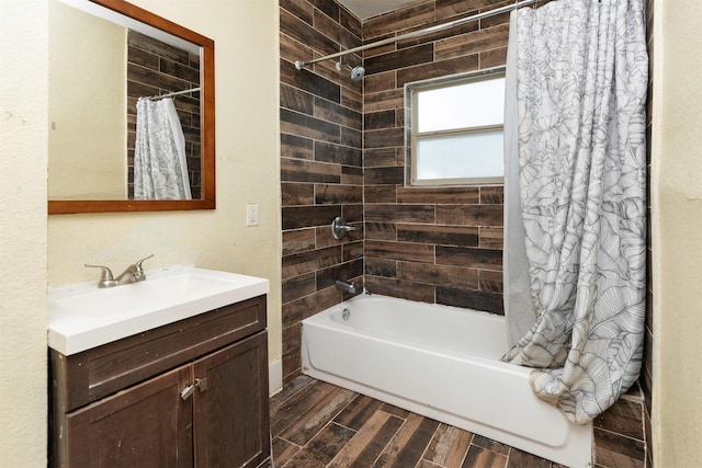 1118 Euclid Ave, Des Moines, IA 50313 - bathroom featuring shower / bath combo with shower curtain, vanity, and wood finished floors