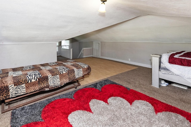 1118 Euclid Ave, Des Moines, IA 50313 - bedroom with lofted ceiling, carpet flooring, and a textured ceiling