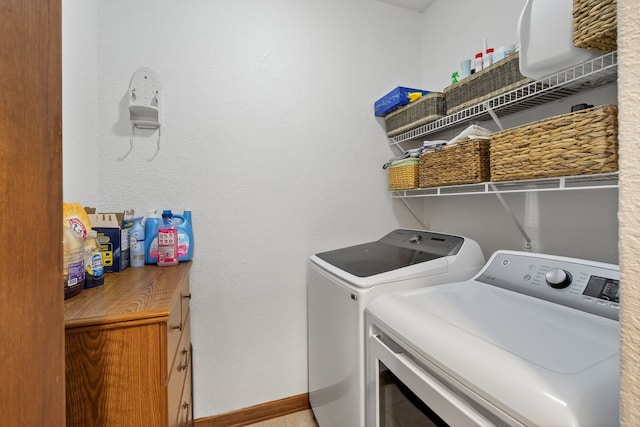 4309 129th St, Urbandale, IA 50323 - washroom with washer and clothes dryer and baseboards