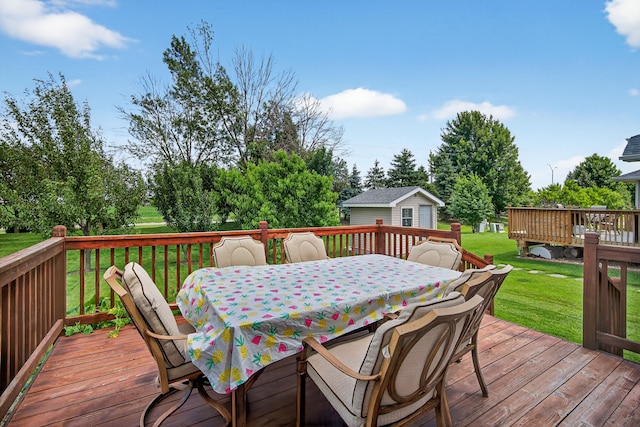 4309 129th St, Urbandale, IA 50323 - deck with outdoor dining space, a yard, and a shed