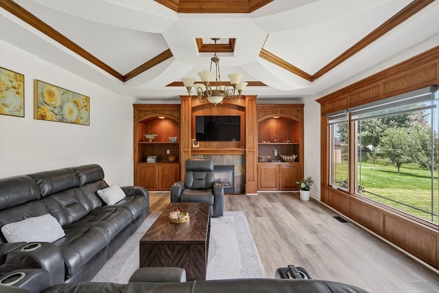 4309 129th St, Urbandale, IA 50323 - living room with coffered ceiling, a tile fireplace, light wood-style flooring, ornamental molding, and a chandelier