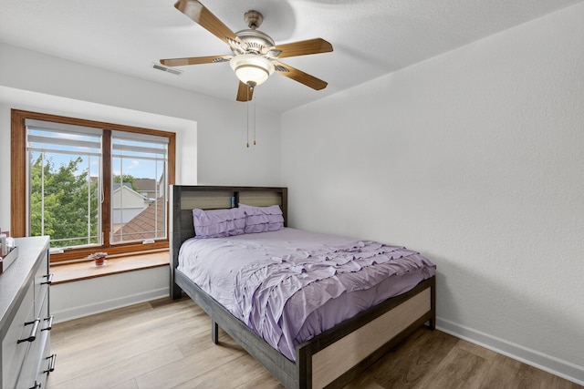 4309 129th St, Urbandale, IA 50323 - bedroom featuring light wood-style flooring and ceiling fan