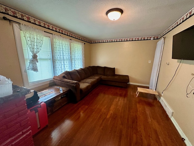 3923 15th St, Des Moines, IA 50313 - living room with wood finished floors and a textured ceiling