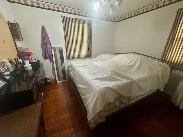 3923 15th St, Des Moines, IA 50313 - bedroom with dark wood-type flooring