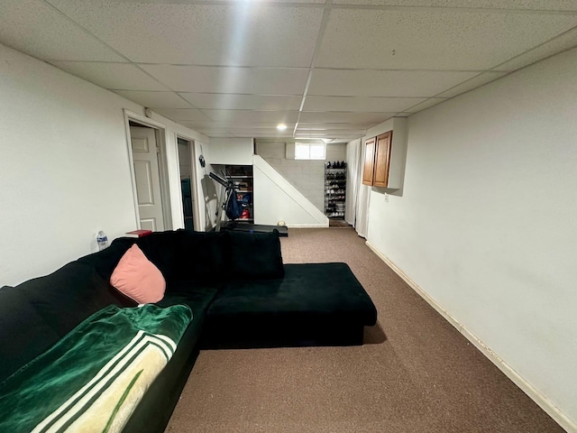 3923 15th St, Des Moines, IA 50313 - carpeted living area with a drop ceiling and baseboards