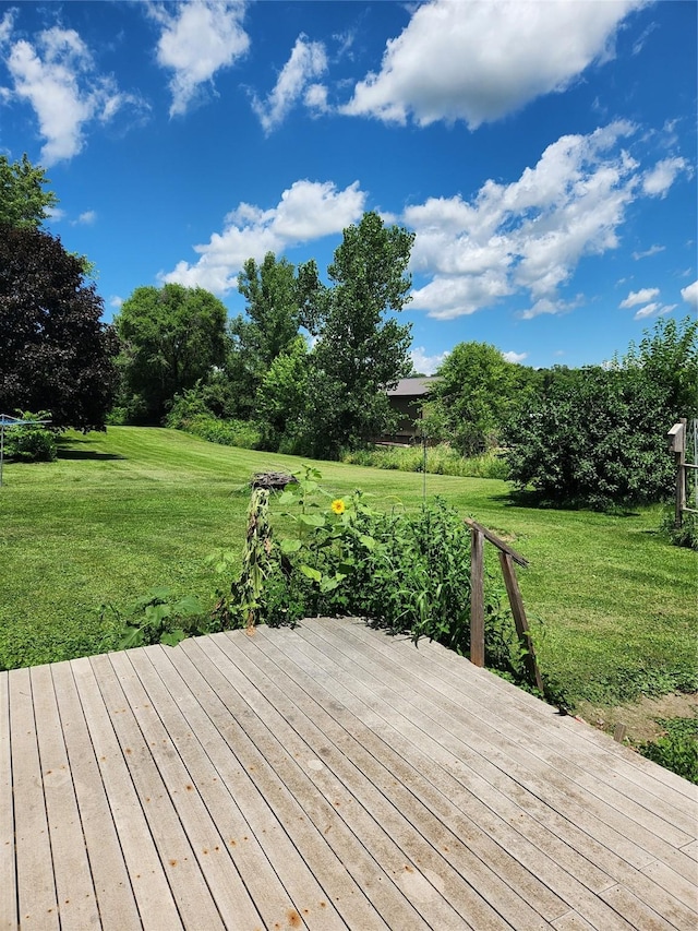 503 Main St, Harvey, IA 50119 - wooden terrace featuring a yard