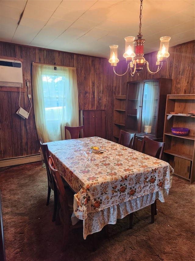 503 Main St, Harvey, IA 50119 - dining space with wooden walls, carpet floors, an AC wall unit, a chandelier, and a baseboard radiator