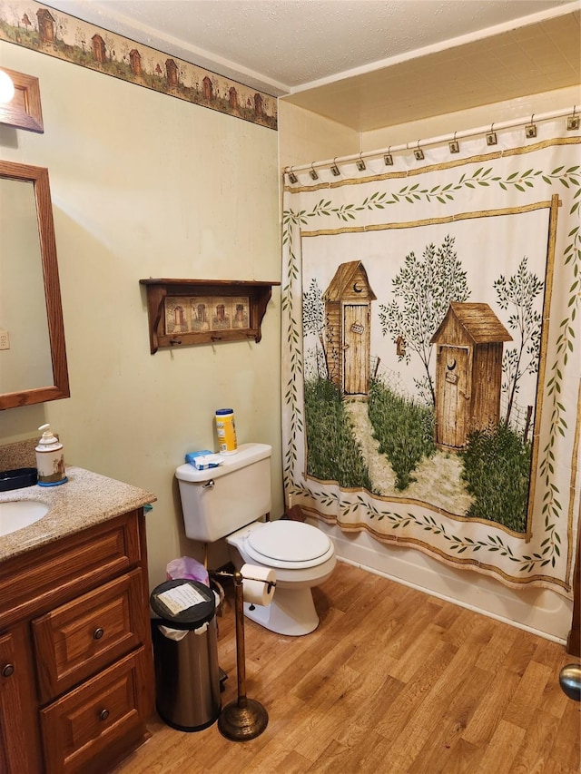 503 Main St, Harvey, IA 50119 - full bath featuring vanity, wood finished floors, and shower / tub combo with curtain