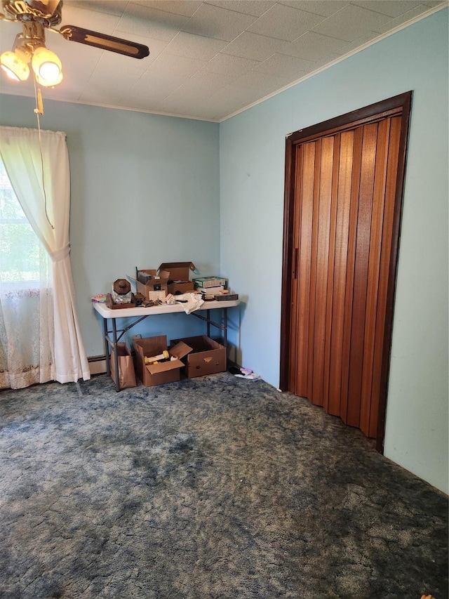 503 Main St, Harvey, IA 50119 - home office featuring carpet floors, a ceiling fan, and crown molding
