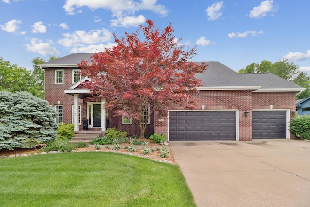 7016 Harbour Dr, Johnston, IA 50131 - view of front of house featuring brick siding, driveway, a garage, and a front lawn