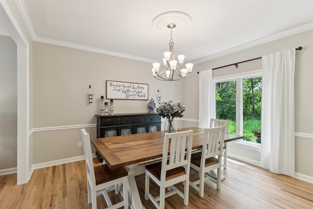 7016 Harbour Dr, Johnston, IA 50131 - dining room with a chandelier, crown molding, and light wood finished floors