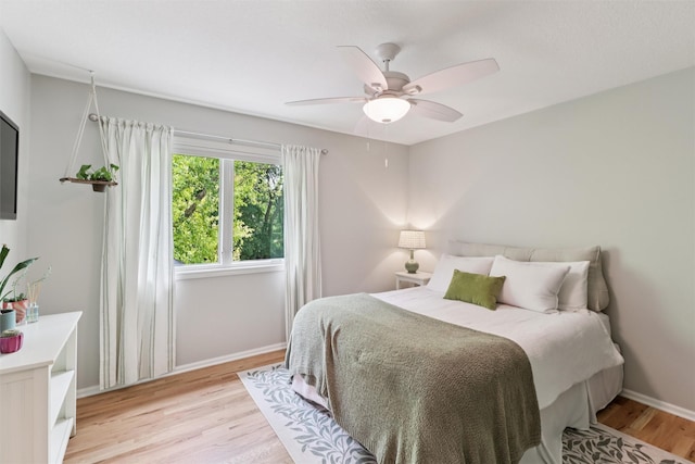 7016 Harbour Dr, Johnston, IA 50131 - bedroom featuring light wood finished floors and ceiling fan