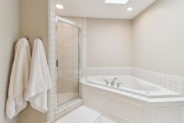 7016 Harbour Dr, Johnston, IA 50131 - bathroom with a stall shower, a garden tub, recessed lighting, tile patterned floors, and a skylight