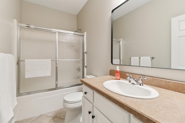 7016 Harbour Dr, Johnston, IA 50131 - bathroom with vanity, tile patterned flooring, and combined bath / shower with glass door