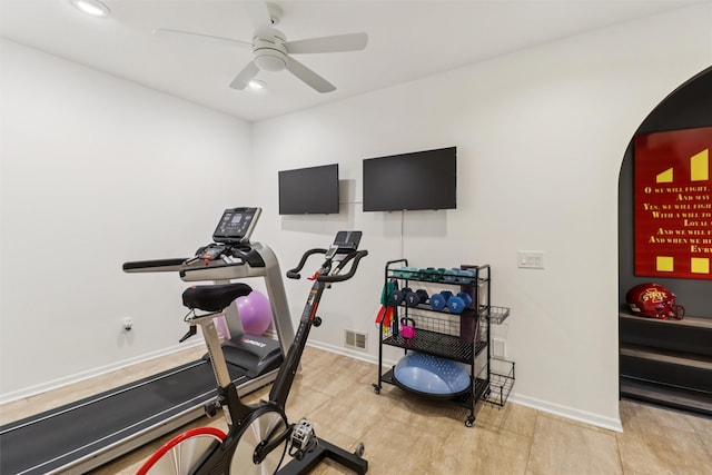 7016 Harbour Dr, Johnston, IA 50131 - workout room featuring ceiling fan, arched walkways, and recessed lighting