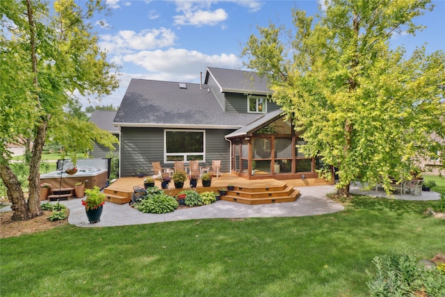 7016 Harbour Dr, Johnston, IA 50131 - back of house with a hot tub, a shingled roof, a deck, and a yard