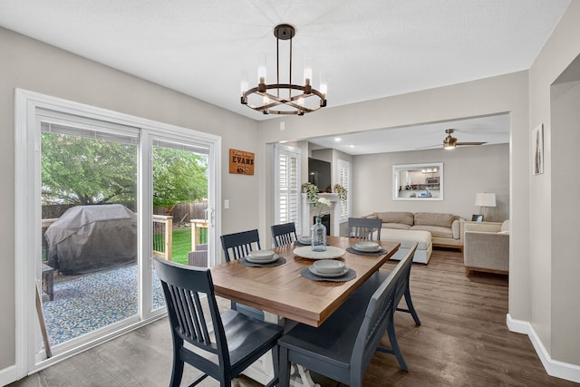 4808 Dewey Pl, Johnston, IA 50131 - dining area featuring wood finished floors, a chandelier, and ceiling fan
