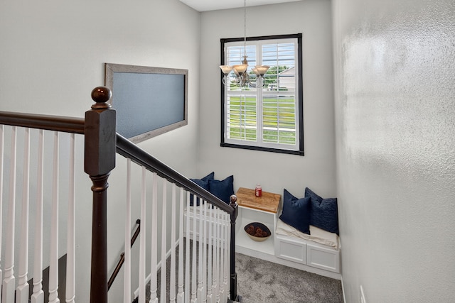 4808 Dewey Pl, Johnston, IA 50131 - stairs with carpet flooring and a chandelier