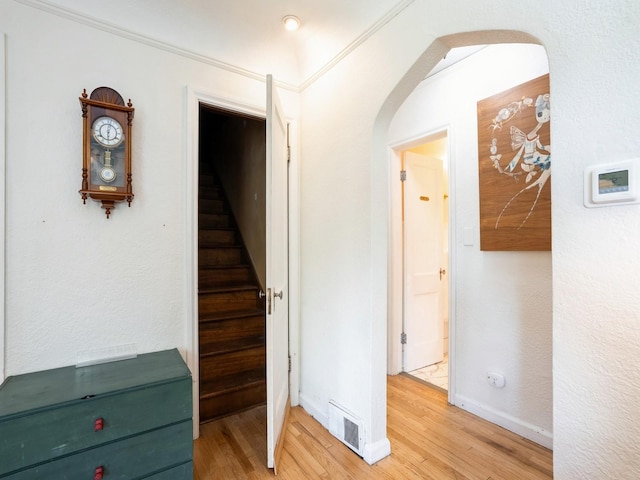 1655 NW Dr, Des Moines, IA 50310 - stairs with arched walkways and wood finished floors