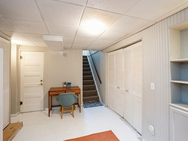 1655 NW Dr, Des Moines, IA 50310 - finished basement featuring stairs and a paneled ceiling