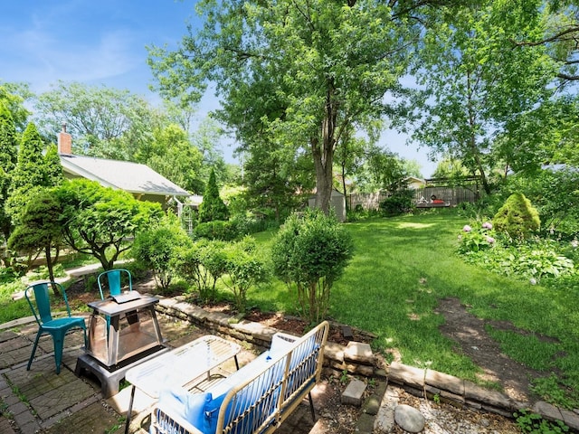 1655 NW Dr, Des Moines, IA 50310 - view of grassy yard featuring view of scattered trees and a patio area