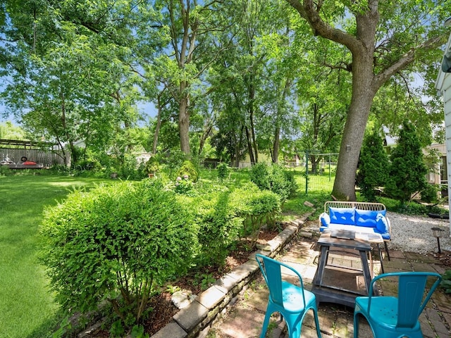 1655 NW Dr, Des Moines, IA 50310 - view of patio / terrace with an outdoor hangout area and view of wooded area