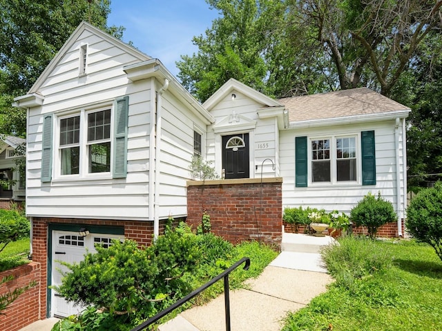 1655 NW Dr, Des Moines, IA 50310 - view of front of home with an attached garage