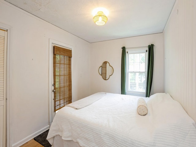 1655 NW Dr, Des Moines, IA 50310 - bedroom with wood finished floors and baseboards