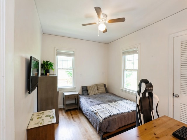 1655 NW Dr, Des Moines, IA 50310 - bedroom with wood finished floors and ceiling fan
