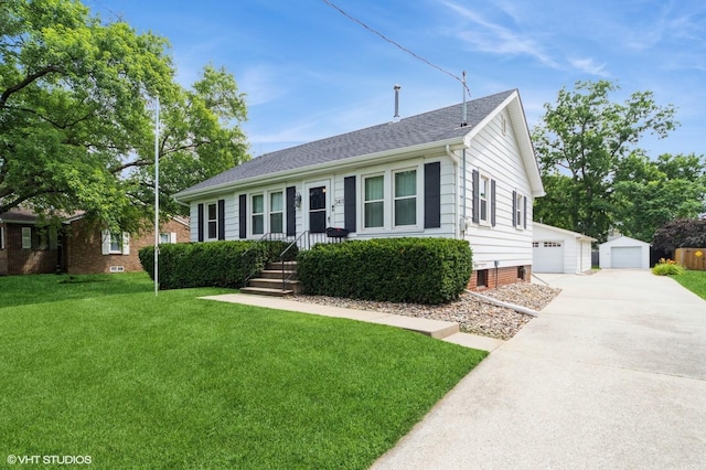3411 61st St, Des Moines, IA 50322 - view of front of house featuring an outdoor structure, a front lawn, and a garage