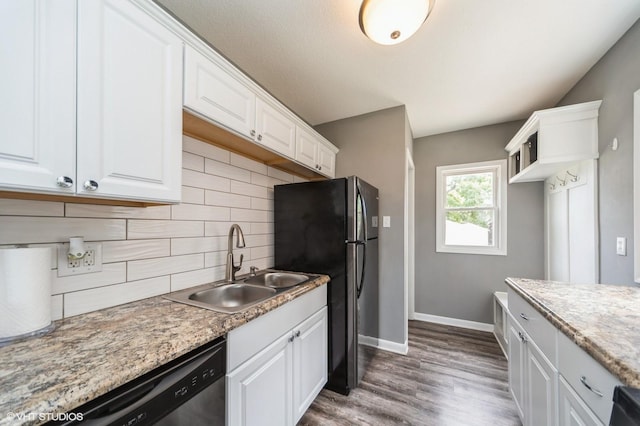 3411 61st St, Des Moines, IA 50322 - kitchen featuring appliances with stainless steel finishes, white cabinets, decorative backsplash, and wood finished floors