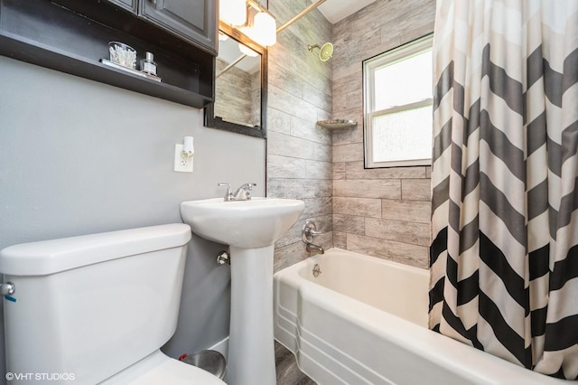 3411 61st St, Des Moines, IA 50322 - bathroom with shower / bath combination with curtain and wood finished floors