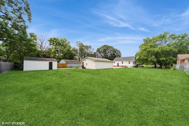 3411 61st St, Des Moines, IA 50322 - view of yard featuring a storage unit