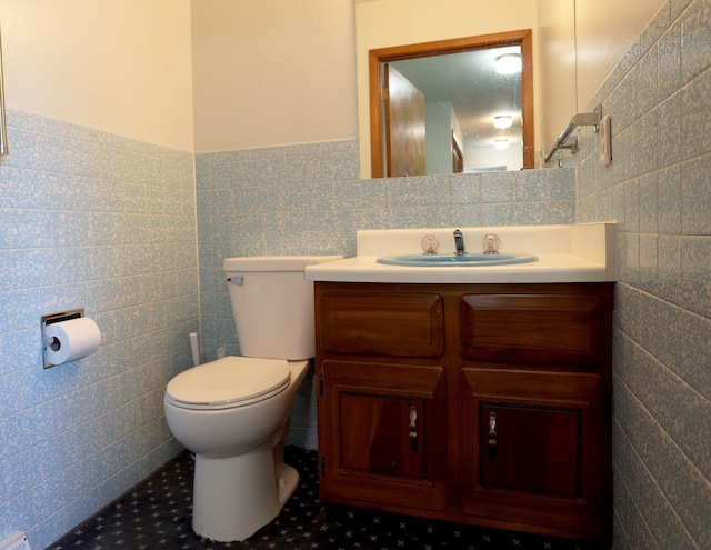 1108 Hillcrest Ct, Chariton, IA 50049 - half bath with tile walls, vanity, and a wainscoted wall