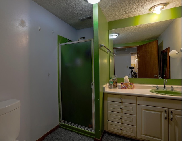 1108 Hillcrest Ct, Chariton, IA 50049 - full bathroom featuring a textured ceiling, a shower stall, and vanity