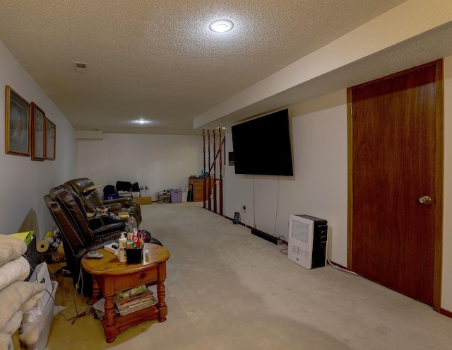 1108 Hillcrest Ct, Chariton, IA 50049 - carpeted living area featuring a textured ceiling and recessed lighting