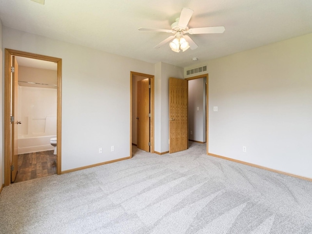 5805 Sterling Trce, Des Moines, IA 50320 - unfurnished bedroom featuring carpet flooring, connected bathroom, and a ceiling fan