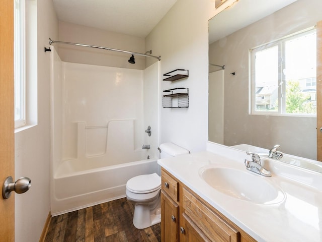 5805 Sterling Trce, Des Moines, IA 50320 - bathroom with vanity, washtub / shower combination, wood finished floors, and healthy amount of natural light