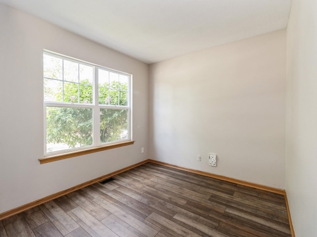 5805 Sterling Trce, Des Moines, IA 50320 - empty room with healthy amount of natural light and hardwood / wood-style flooring