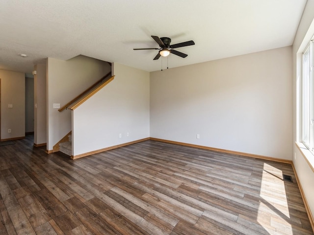 5805 Sterling Trce, Des Moines, IA 50320 - empty room with wood finished floors, ceiling fan, and stairs
