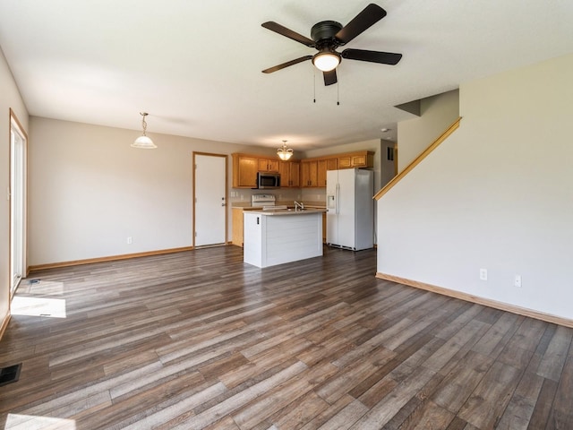 5805 Sterling Trce, Des Moines, IA 50320 - unfurnished living room featuring a ceiling fan and dark wood finished floors