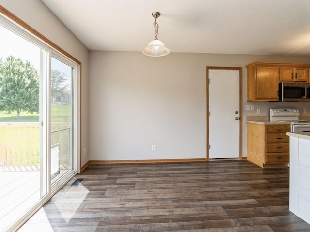 5805 Sterling Trce, Des Moines, IA 50320 - kitchen featuring stainless steel microwave, white electric range, light countertops, and dark wood finished floors
