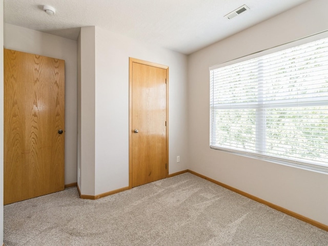 5805 Sterling Trce, Des Moines, IA 50320 - unfurnished bedroom with carpet and baseboards
