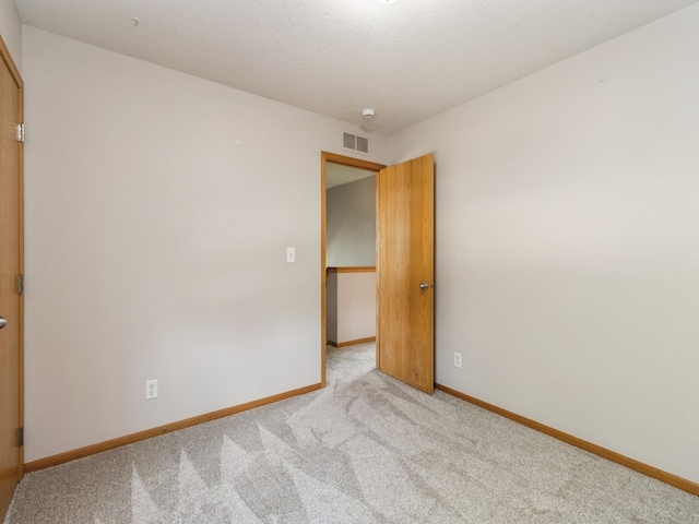 5805 Sterling Trce, Des Moines, IA 50320 - unfurnished room with light colored carpet and baseboards