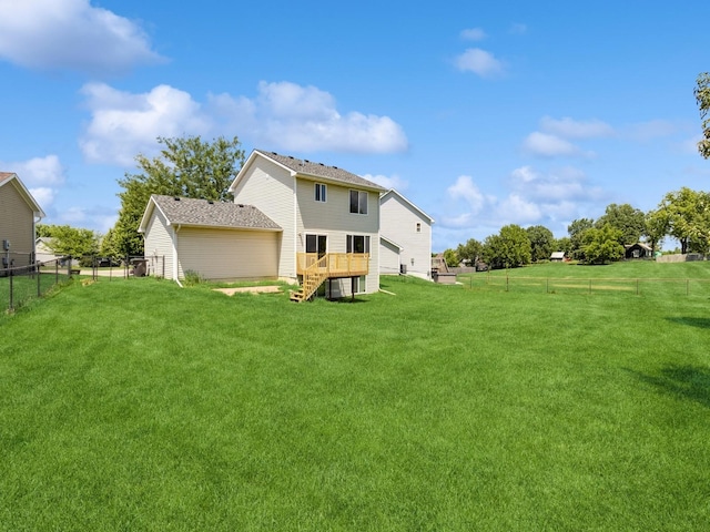 5805 Sterling Trce, Des Moines, IA 50320 - back of property featuring a fenced backyard, a wooden deck, and stairs